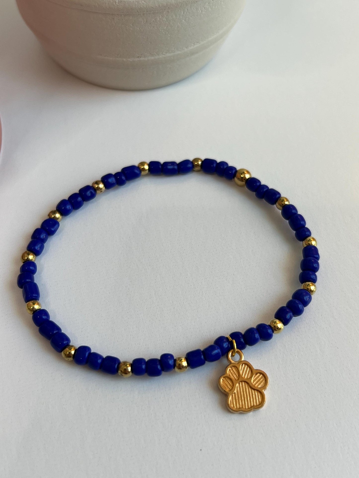 Handmade Beaded Bracelet: Royal Blue, Gold Paw Print Charm